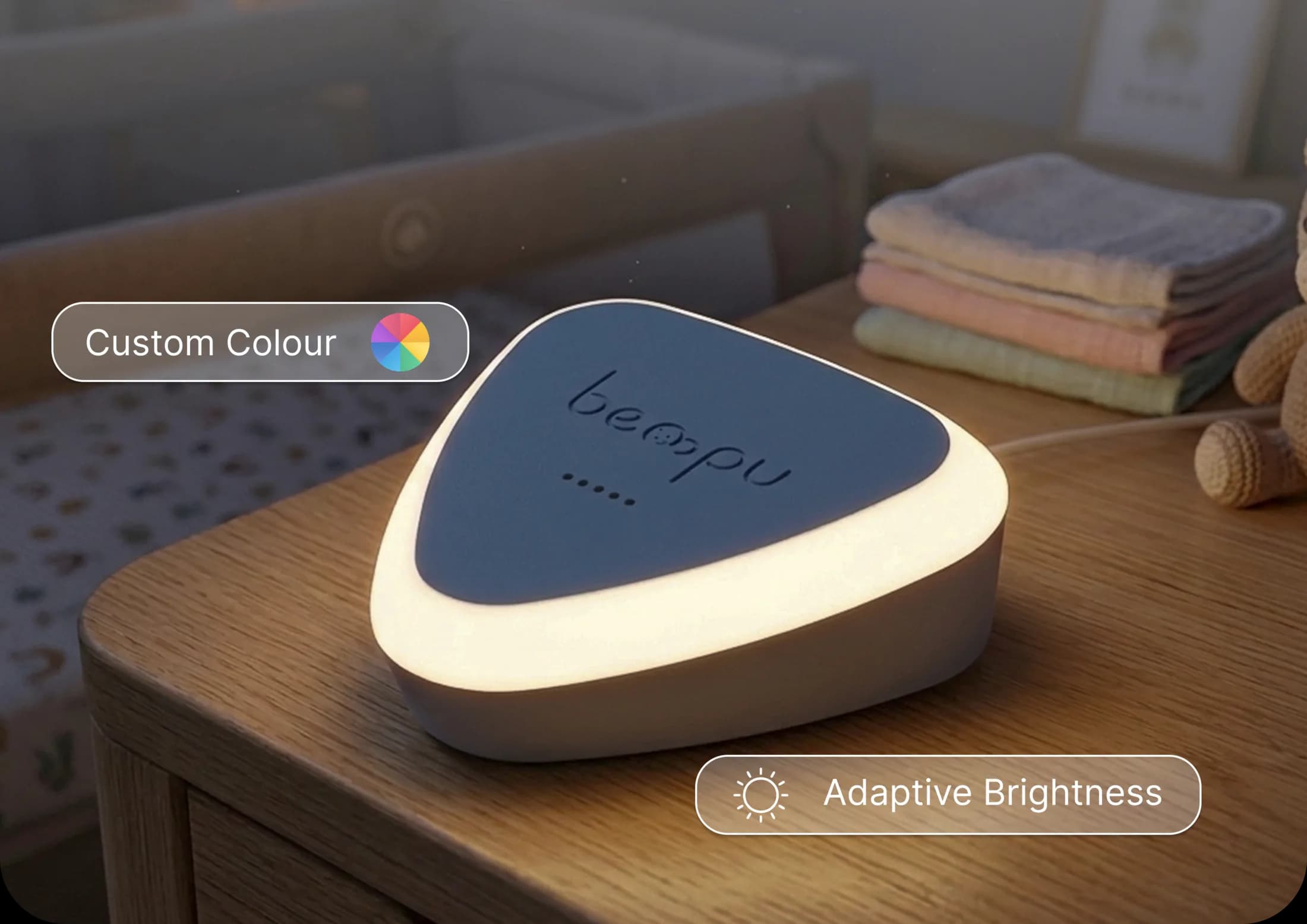 BEMPU BaseStation glowing as a nursery nightlight on a bedside table