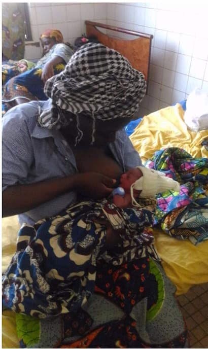 Togo — Mother with her baby wearing TempWatch